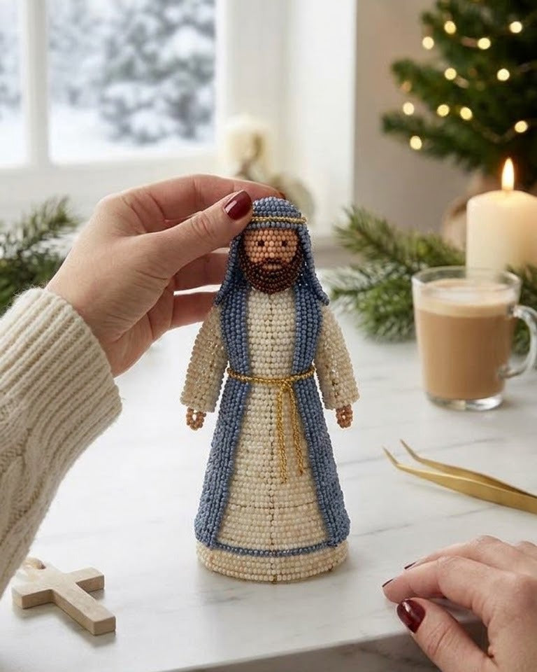 A finished beaded Joseph figure held in the hand