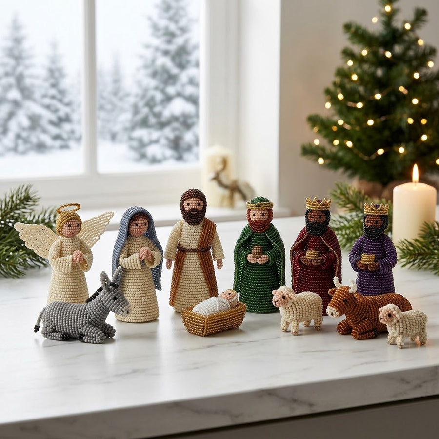 The finished Jesus Beads nativity set, twelve beaded figures on a marble counter